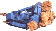 A tracked cutting machine with a blue body and orange rotary cutting heads.