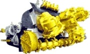 A tracked cutting machine with several yellow rotary cutting heads across its front.